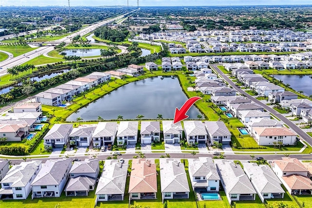 drone / aerial view featuring a water view