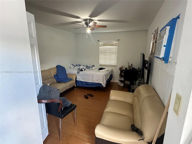 bedroom with ceiling fan and hardwood / wood-style floors