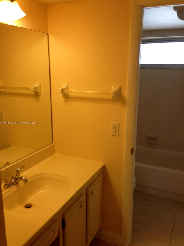 full bathroom with tub / shower combination, tile patterned flooring, vanity, and toilet