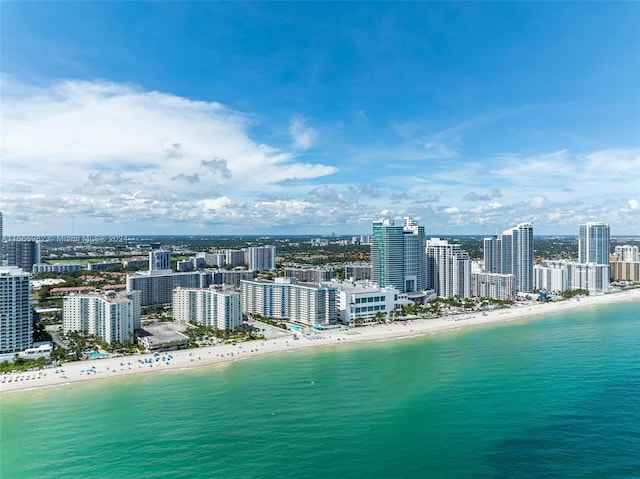 bird's eye view featuring a water view and a view of the beach