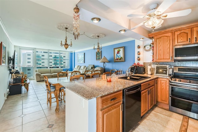 kitchen with decorative backsplash, sink, stainless steel appliances, kitchen peninsula, and ornamental molding