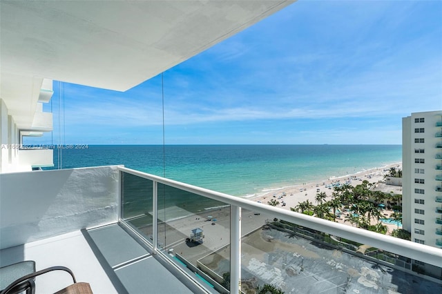 balcony with a view of the beach and a water view