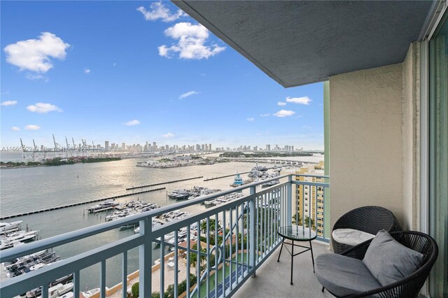 balcony featuring a water view