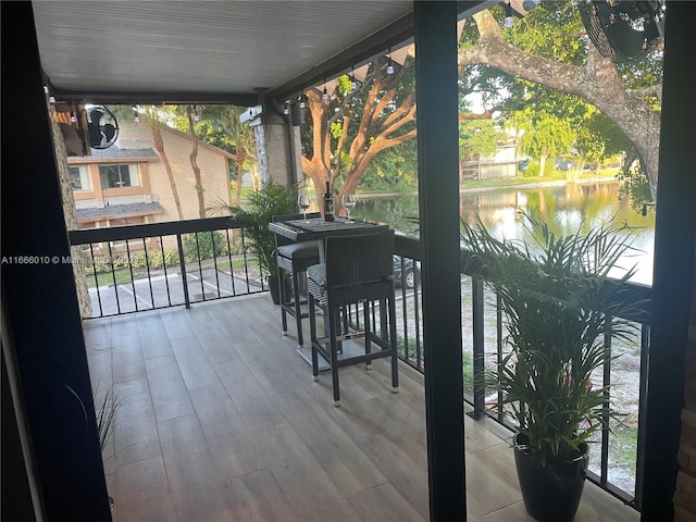 balcony featuring a water view