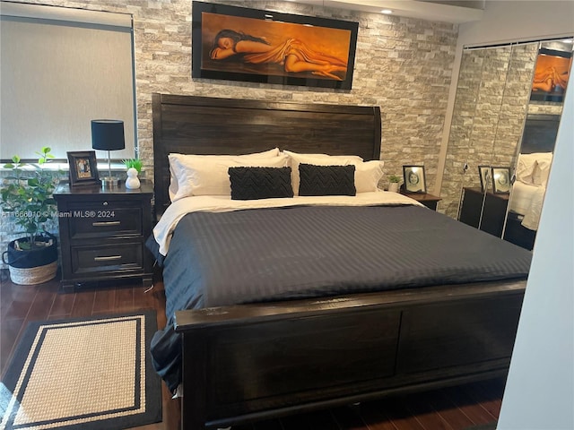 bedroom featuring dark hardwood / wood-style flooring