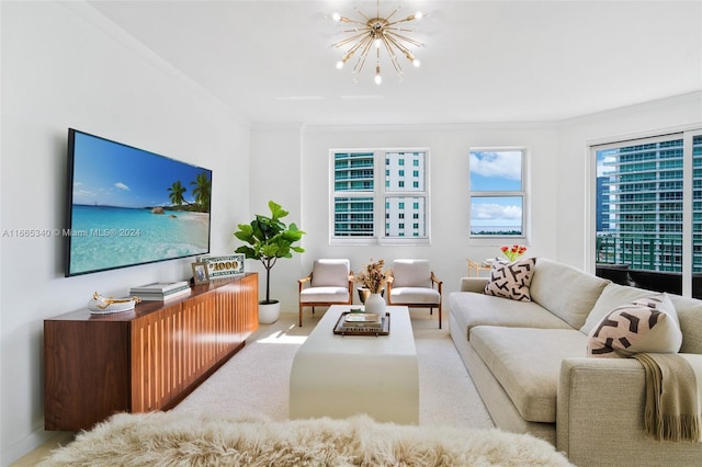 living room with a notable chandelier and crown molding