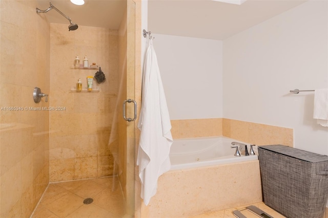 bathroom with tile patterned flooring and independent shower and bath