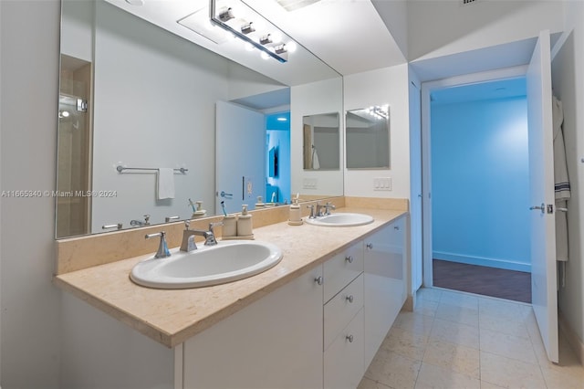 bathroom with vanity and tile patterned flooring