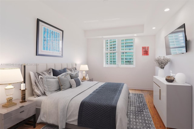 bedroom with light hardwood / wood-style floors