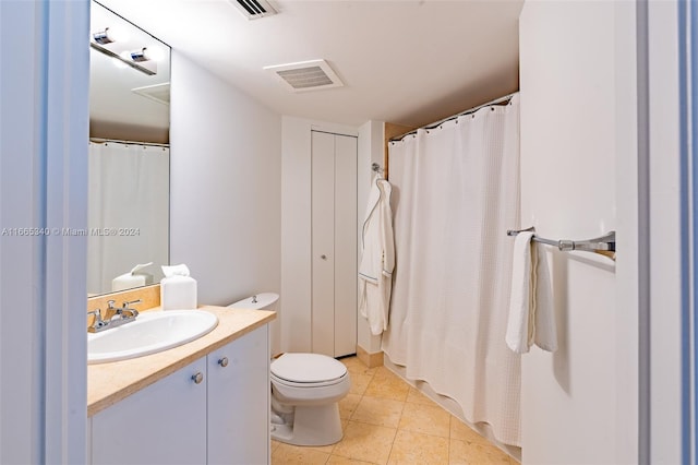 bathroom featuring tile patterned floors, walk in shower, vanity, and toilet