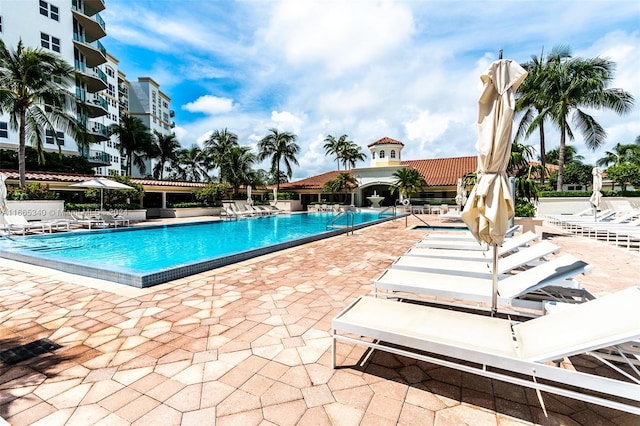 view of swimming pool featuring a patio area