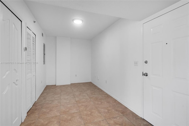 unfurnished bedroom featuring light tile patterned floors