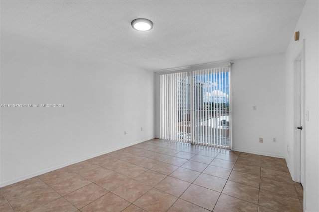 view of tiled spare room