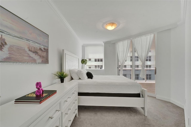 bedroom with carpet floors and crown molding