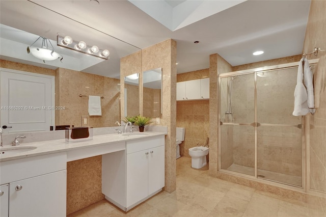 bathroom featuring tile walls, an enclosed shower, a bidet, and vanity