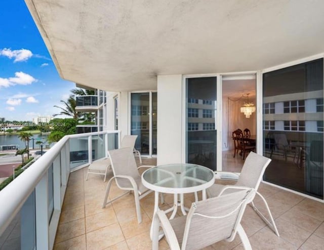 balcony featuring a water view