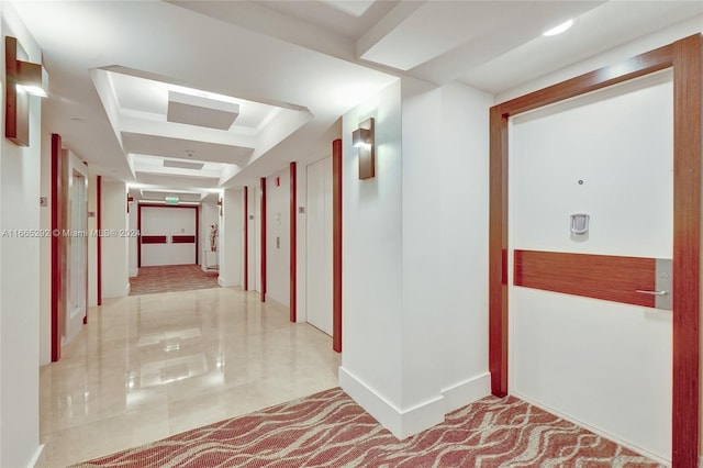 hallway with a tray ceiling