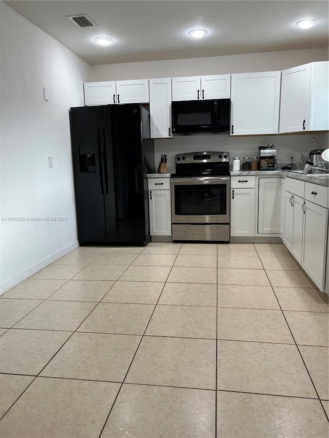 14721 Arbuckle Creek Rd, Sebring, FL 33870 - kitchen with black appliances, light tile patterned flooring, white cabinetry, and sink