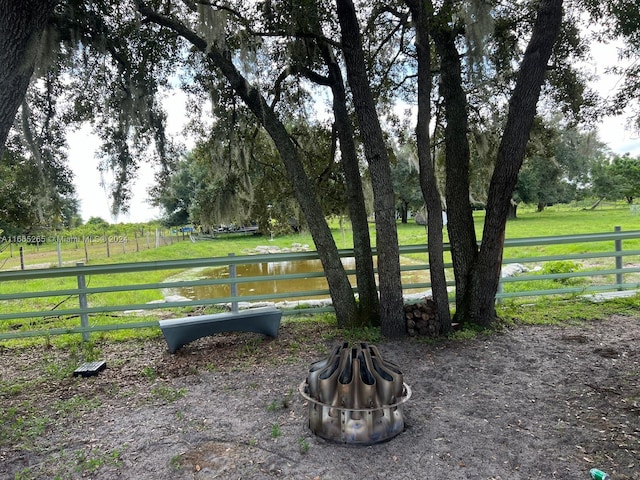 14721 Arbuckle Creek Rd, Sebring, FL 33870 - view of property's community featuring a rural view, an outdoor fire pit, and a yard