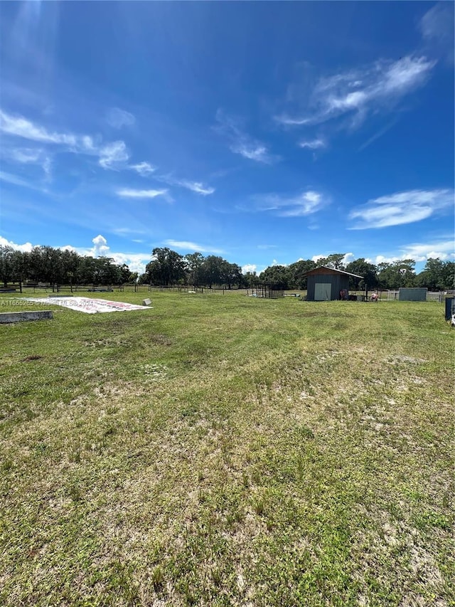 14721 Arbuckle Creek Rd, Sebring, FL 33870 - view of yard featuring a rural view and a storage shed