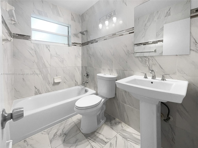 full bathroom with tiled shower / bath combo, tile walls, and toilet