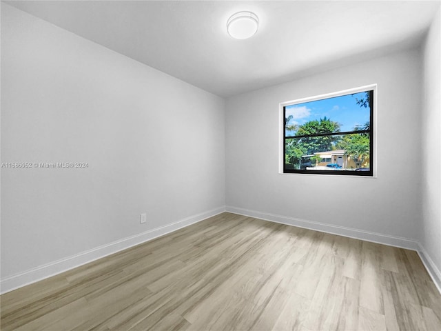 spare room featuring light hardwood / wood-style floors