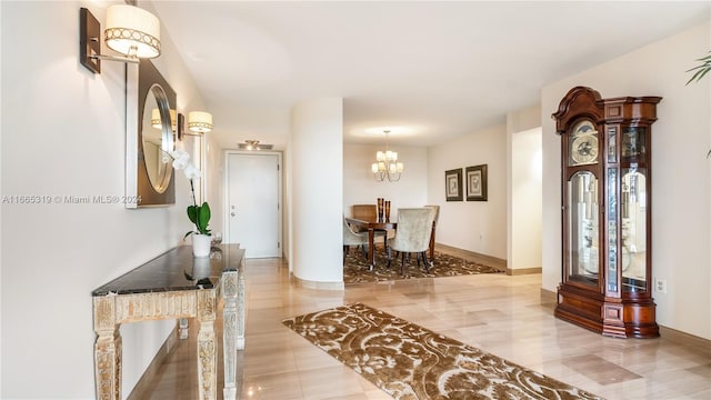 foyer featuring a chandelier