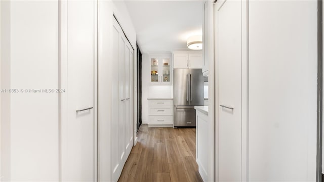 corridor featuring light hardwood / wood-style floors