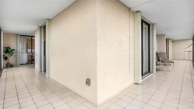 hallway with light tile patterned floors