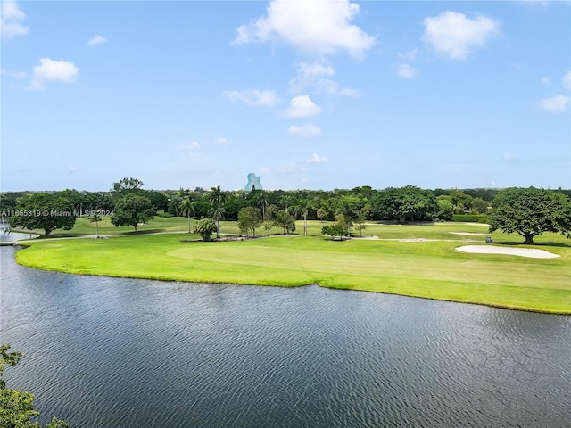 view of property's community featuring a water view and a yard