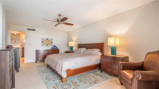 bedroom with light carpet and ceiling fan