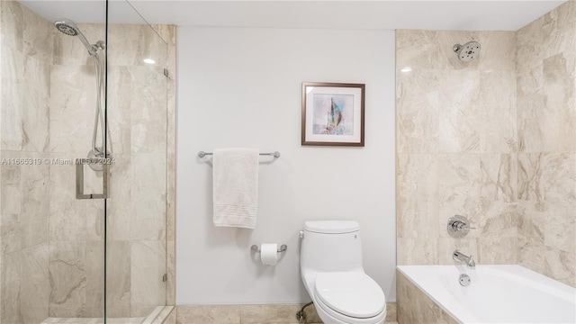 bathroom featuring shower with separate bathtub and toilet