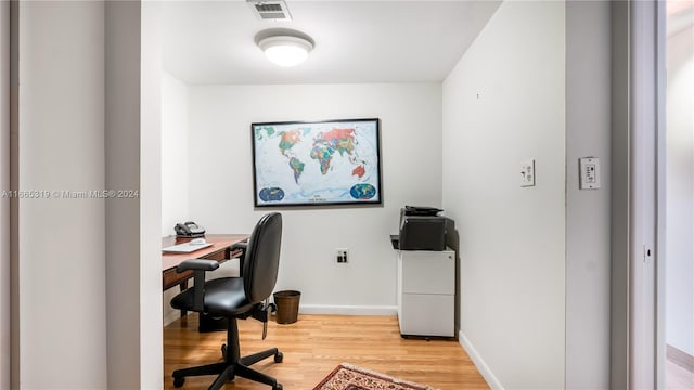 office space with light hardwood / wood-style floors