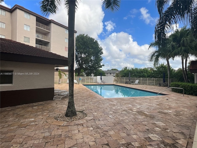 view of pool featuring a patio area