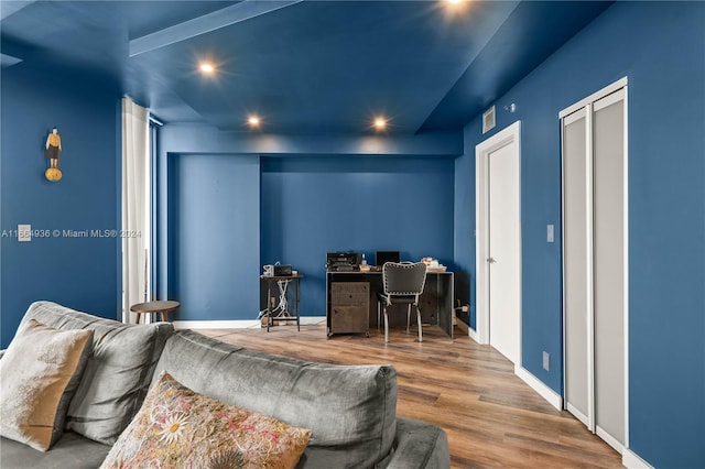 home office with baseboards, wood finished floors, visible vents, and recessed lighting
