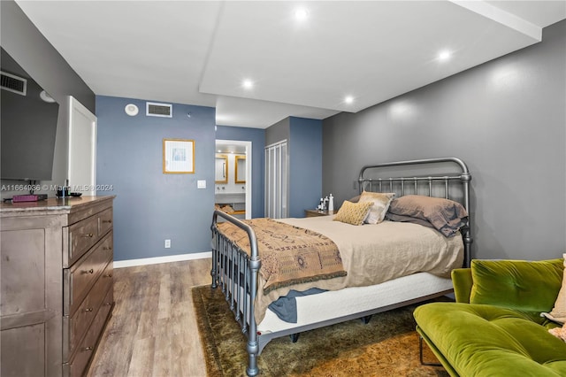 bedroom featuring dark hardwood / wood-style floors