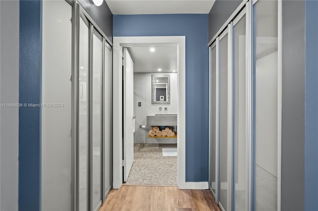 corridor with light wood finished floors