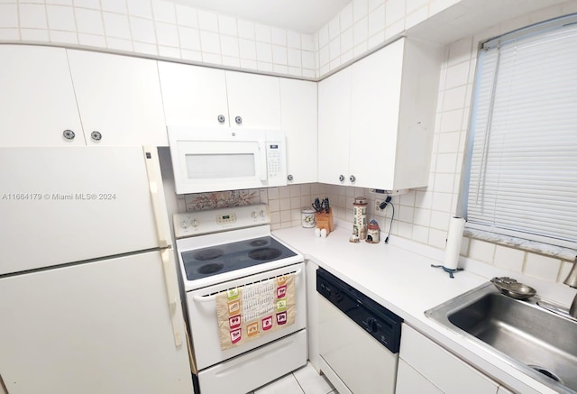 kitchen with white cabinets, white appliances, backsplash, and sink