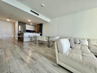 living room featuring light wood-type flooring