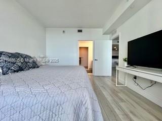 bedroom with light wood-type flooring