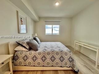 bedroom featuring wood finished floors