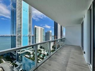 balcony featuring a water view and a view of city