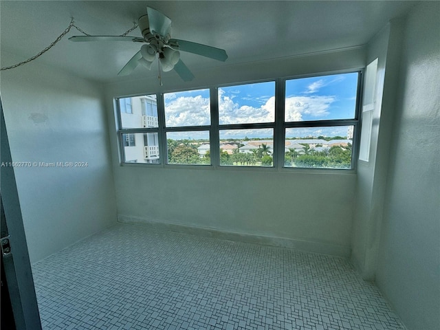 spare room with ceiling fan