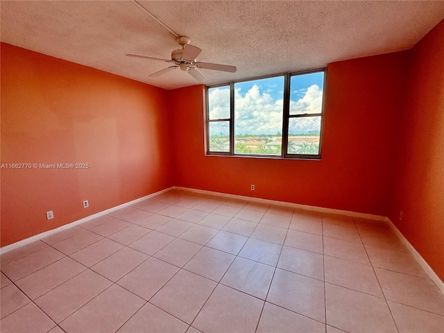 walk in closet with light tile patterned floors