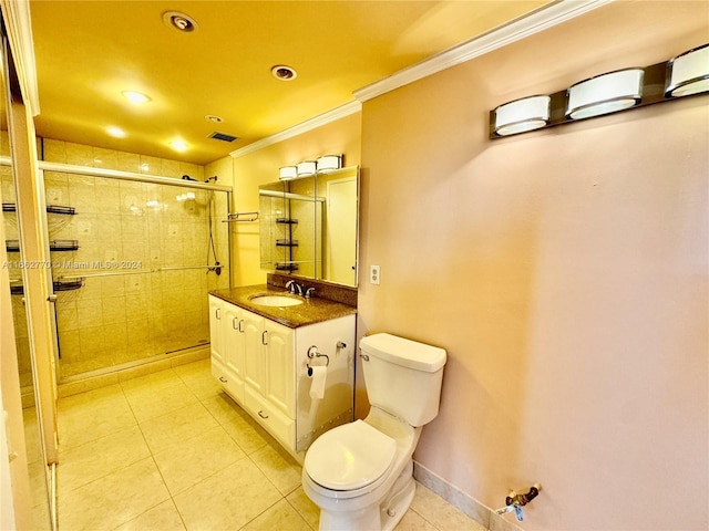 bathroom with vanity, toilet, an enclosed shower, and ornamental molding