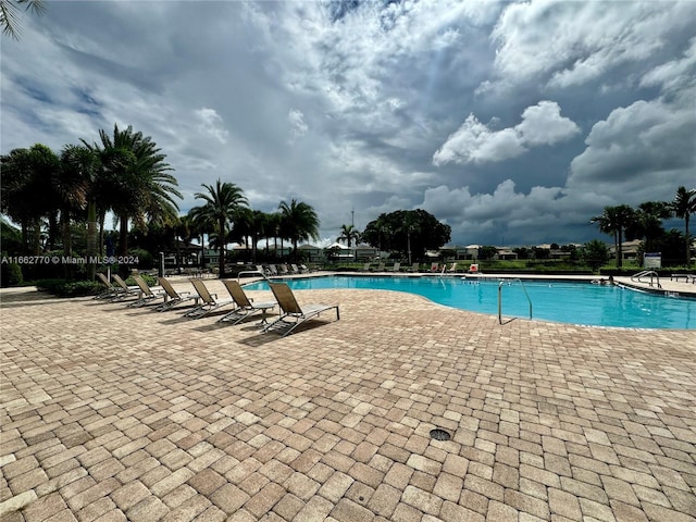 view of swimming pool with a patio area