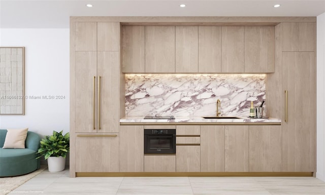 interior space featuring tile patterned flooring, sink, and black appliances