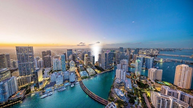 aerial view at dusk with a water view