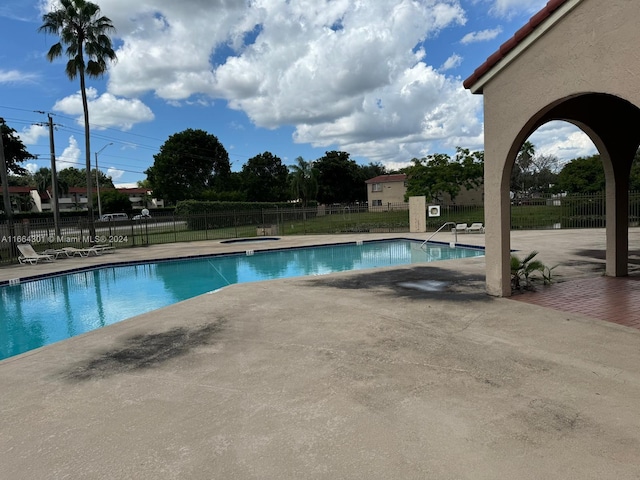 view of swimming pool featuring a patio area