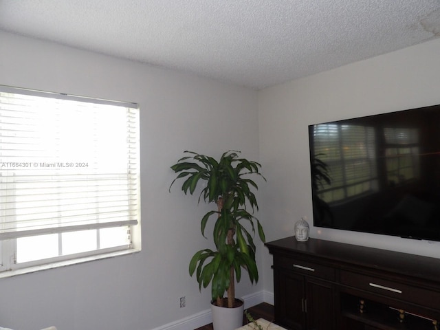 interior space featuring a textured ceiling